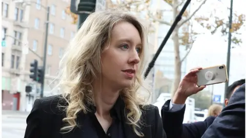 Getty Images Elizabeth Holmes appears in federal court for sentencing after being convicted of four counts of fraud, November 18, 2022