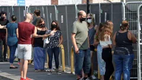 PA Media People queue for tests at Southampton