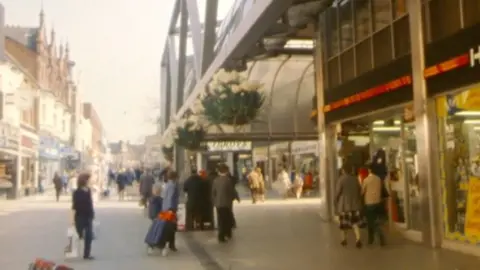 The brunel centre outside, people shopping