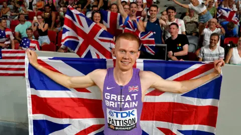 Ben Pattison celebrates his world bronze