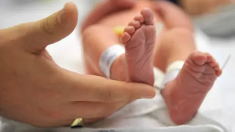 BBC Hand and baby's feet