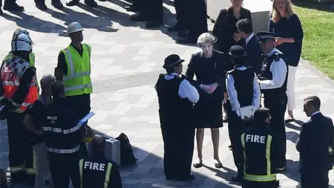 EPA Theresa May meets fire fighters at the Grenfell Tower site