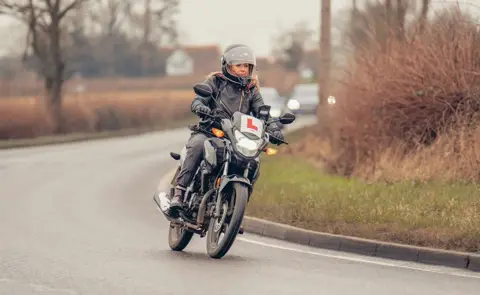 Karina Artun Karina Artun on a motorbike