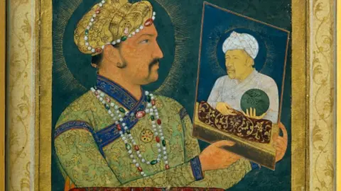 Getty Images Portrait of Akbar (1542-1605) holding the portrait of his father. Paris, musee Guimet