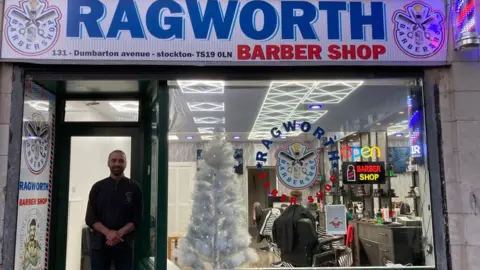 BBC Mohammed Niromande outside of Ragworth Barber Shop