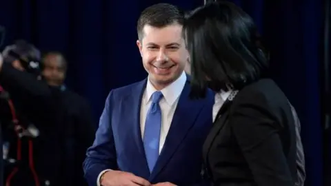 AFP/Getty Images Pete Buttigieg speaks to reporters after the debate in Manchester, New Hampshire. Photo: 7 February 2020