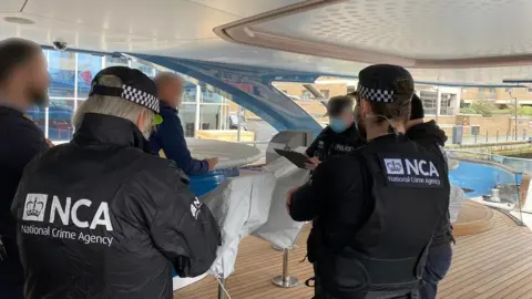 National Crime Agency Officers on board Phi