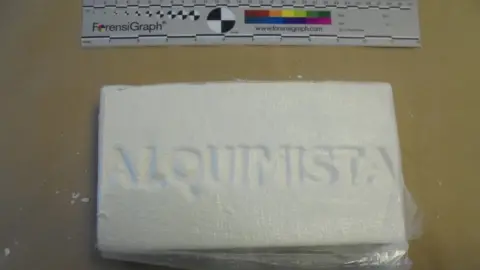 National Crime Agency A rectangular-shaped slab of white powder
