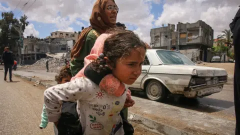 Getty Images Palestinians flee Rafah following Israeli army evacuation orders. Photo: 6 May 2024