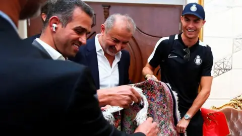 Reuters ronaldo look at a carpet