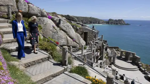 Simon Dawson/No 10 Prime Ministers wife Carrie Johnson walks with US First Lady Dr Jill Biden at the Minack Theatre