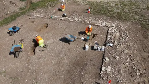 Oxford Archaeology Burial excavation within a Roman building