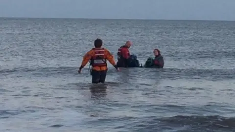 HM Coastguard Divers and the coastguard rescuing the porpoise on Saturday