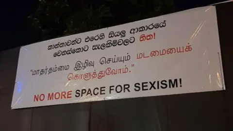 Marisa de Silva New banner reading no space for sexism