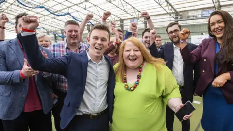 Liam McBurney Newly elected Alliance Party of NI MLA Eoin Tennyson with his party leader Naomi Long