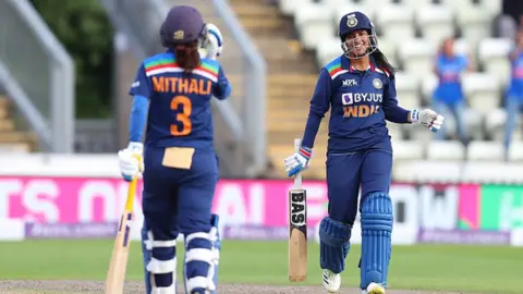 Getty Images Sneh Rana and Mithali Raj of India during the Women's Third One Day International (ODI) match between England and India at New Road on July 03, 2021 in Worcester, England