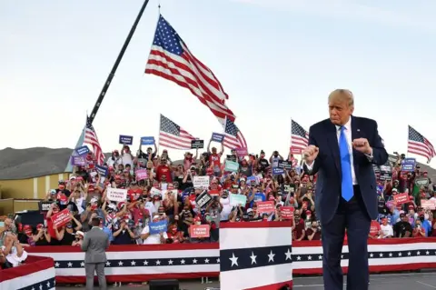 Getty Images Trump dances at a rally in Carson City