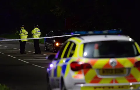 Matt Gilley Police officers at crash scene