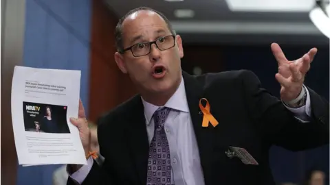 Getty Images Fred Guttenberg gestures as he speaks