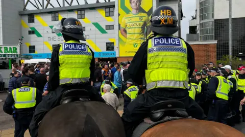 John Fairhall/BBC Police horses outside the Carrow Road stadium