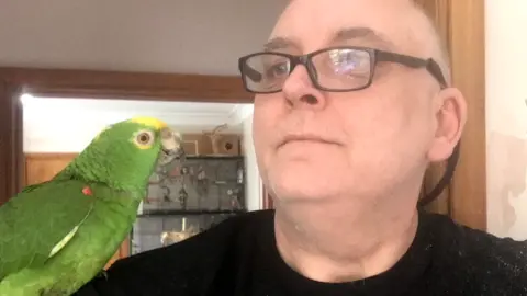 Steve Wood Freddie the parrot and Steve Wood
