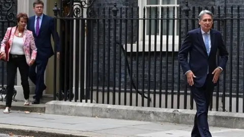 AFP Philip Hammond leaving Downing Street in July