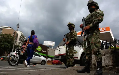 EPA Colombian military guard the streets of Cali after violent day of protests