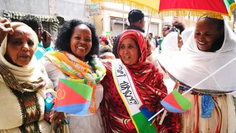 Mela Gebre Medhin Women with flags in Asmara