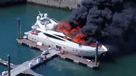 Reuters Superyacht with flames and black smoke