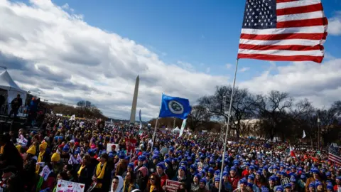 Getty Images People listen during a rally for the 50th annual March for Life rally on the National Mall on January 20, 2023 in Washington, DC.