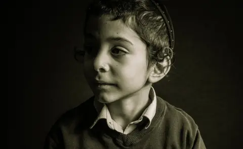 Jeffrey Graham A photo of a boy named Eli - voted third in Advanced Open Print