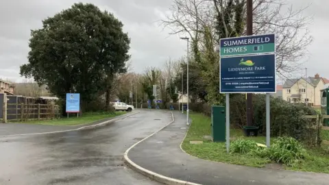 Daniel Mumby Summerfield Homes sign at the front of Liddymore Park