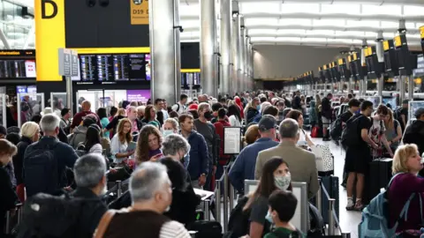 Reuters Passengers in Heathrow terminal in June 2022