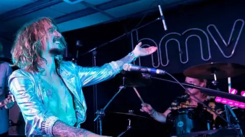 Getty Images The Darkness performing at HMV's Oxford Street store