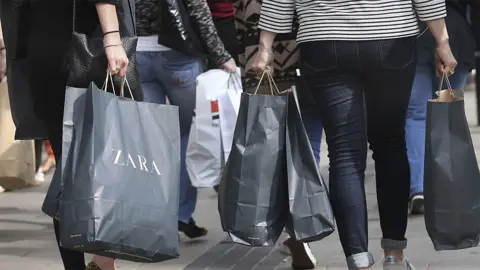 Shoppers carrying shopping bags