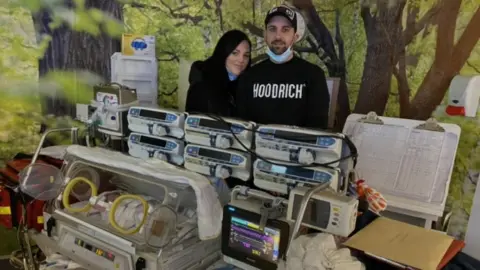 Rachel Stonehouse Rachel and Corey ready to move baby Imogen to the SCBU unit in the Princess Of Wales Hospital.