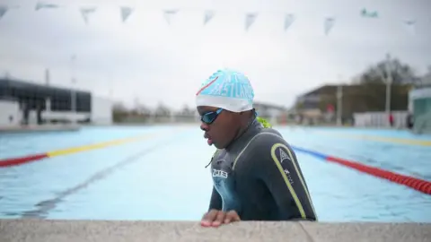 PA Media A swimmer at Hillingdon Lido in Uxbridge