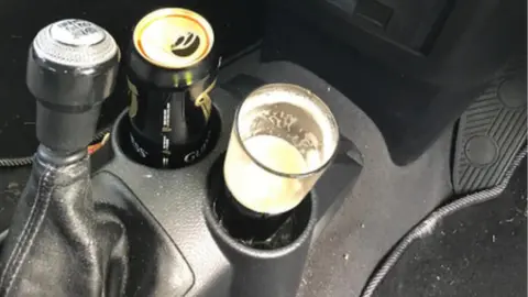 West Midlands Police The can of Guinness and a half full pint glass