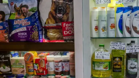 Getty Images Some food stores sell imported products in dollars.