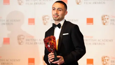 Getty Images British actor Adam Deacon poses with the Rising Star Award at the BAFTA British Academy Film Awards at the Royal Opera House in London on February 12, 2012.