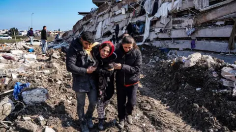 Getty Images Damaged buildings in Hatay on February 8, 2023 in Hatay, Türkiye