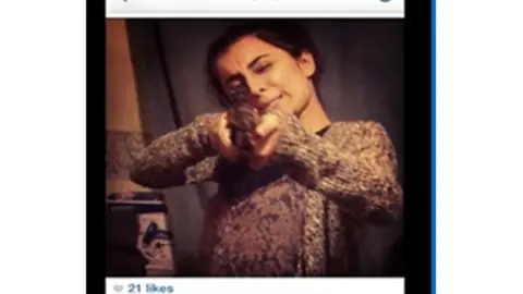 Instagram Madihah Taheer with her partner's air rifle