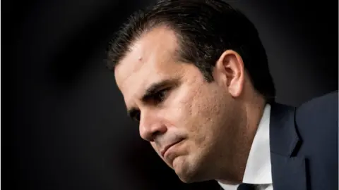 Getty Images Governor Ricardo Rossello listens during a press conference on Capitol Hill January 10, 2018