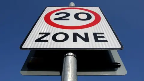 PA Media A 20mph sign