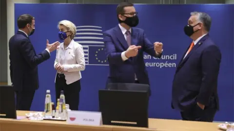 EPA French President Emmanuel Macron (L) speaks with European Commission President Ursula von der Leyen as Hungary's Prime Minister Viktor Orban (R) speaks with Poland's Prime Minister Mateusz Morawiecki at the start of a two days face-to-face EU summit , in Brussels, Belgium, 10 December 2020.