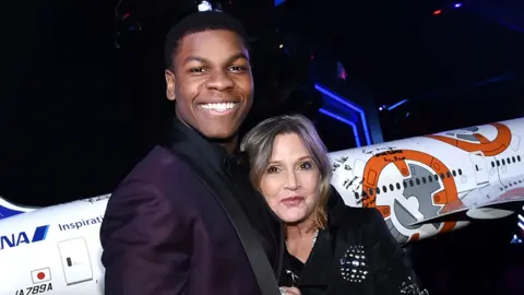 Getty Images John Boyega and Carrie Fisher