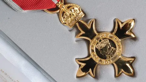 PA Media OBE medal