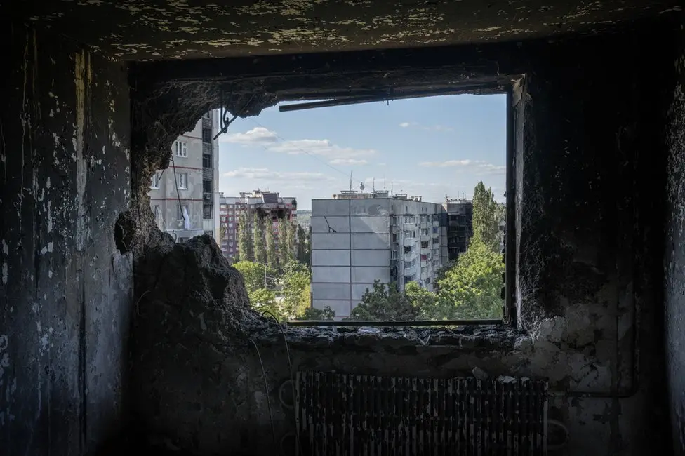 BBC The view from a destroyed Saltivka apartment. Many have been turned to little more than ash