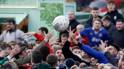 Reuters Players fight for the ball