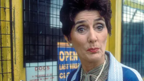 June Brown as Dot Cotton